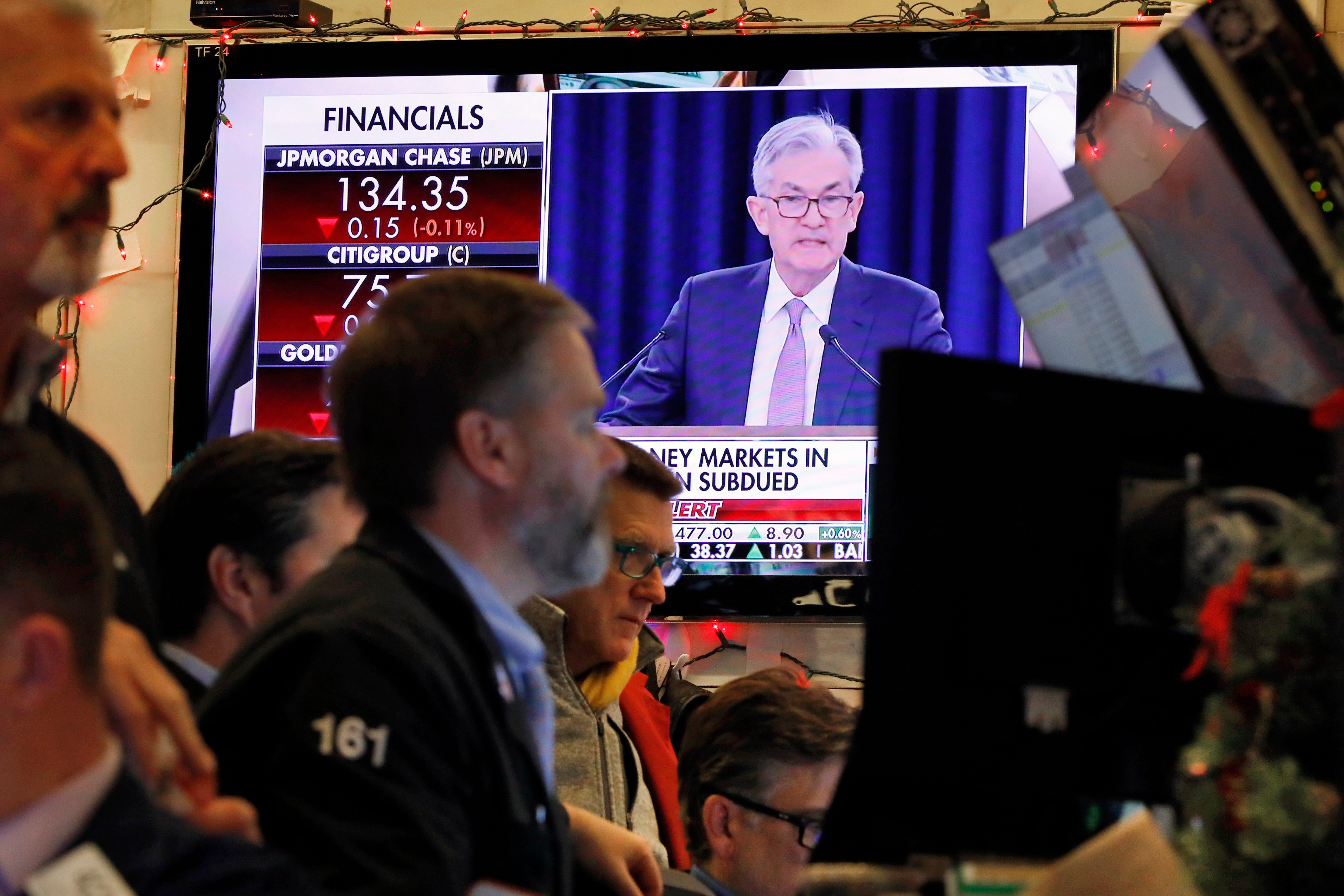 FILE - In this Dec. 11, 2019, file photo a television screen on the floor of the New York Stock Exchange shows Federal Reserve Board Chair Jerome Powell's Washington news conference. The Federal Reserve approved a proposal Thursday, Jan. 30, 2020, to loosen a financial-crisis<br /><a href=