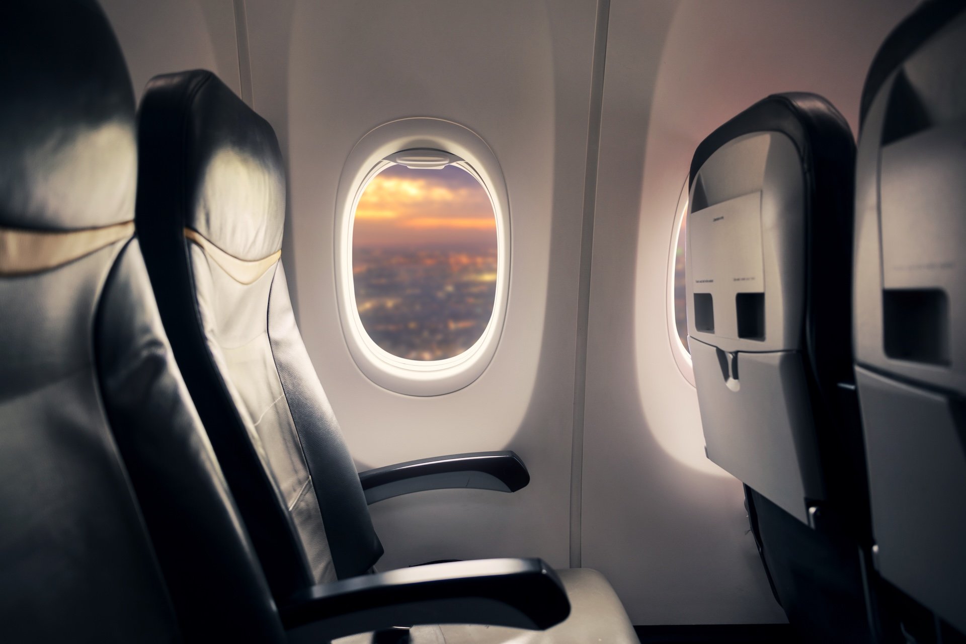 Empty,seat,on,airplane,while,covid 19,outbreak,destroy,travel,and