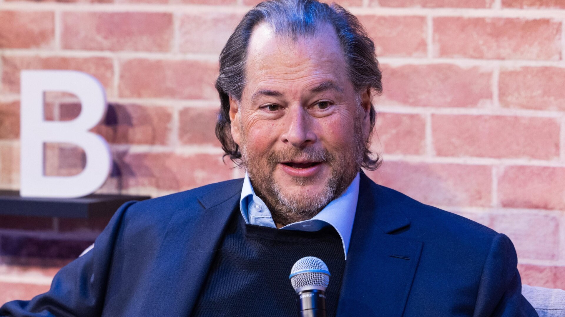 Marc Benioff speaking into a microphone