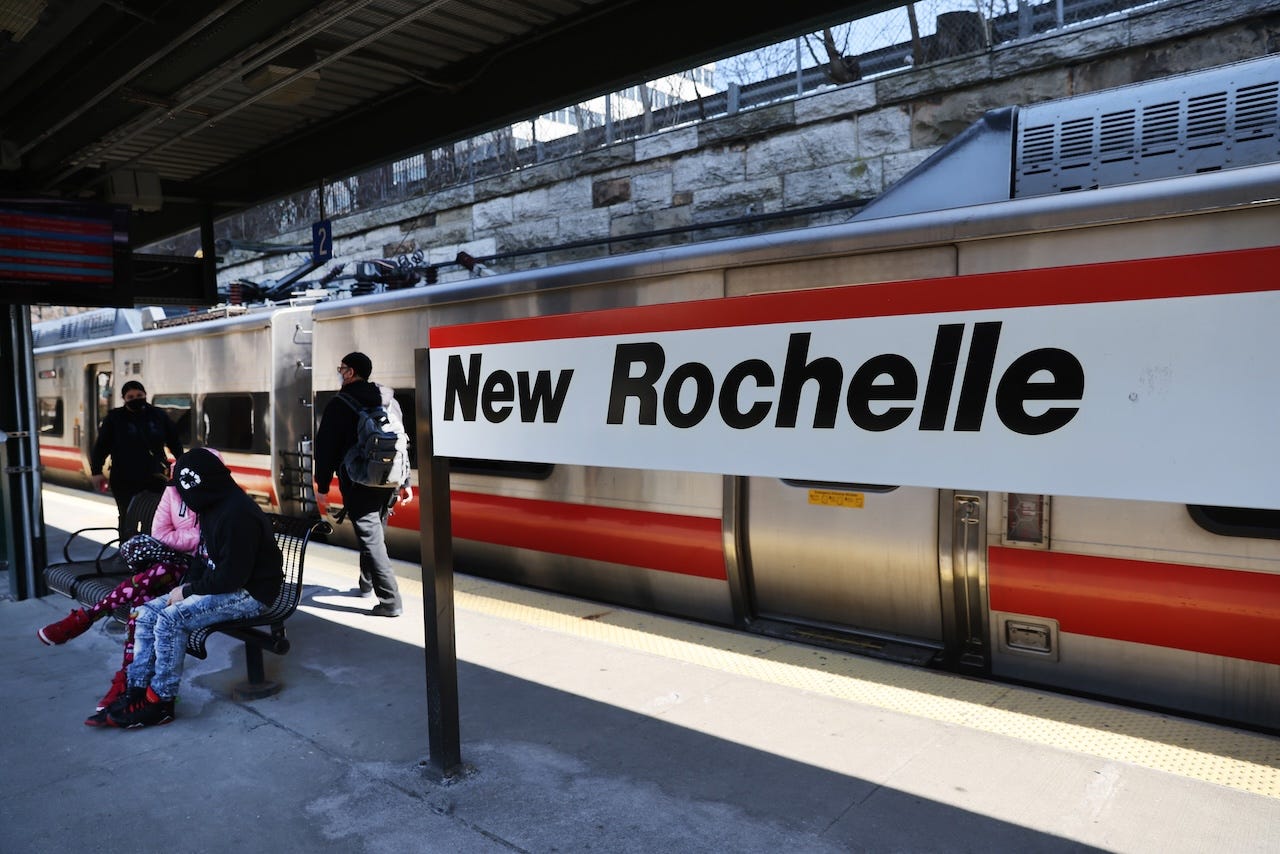 People wait for a train in New Rochelle, New York.
