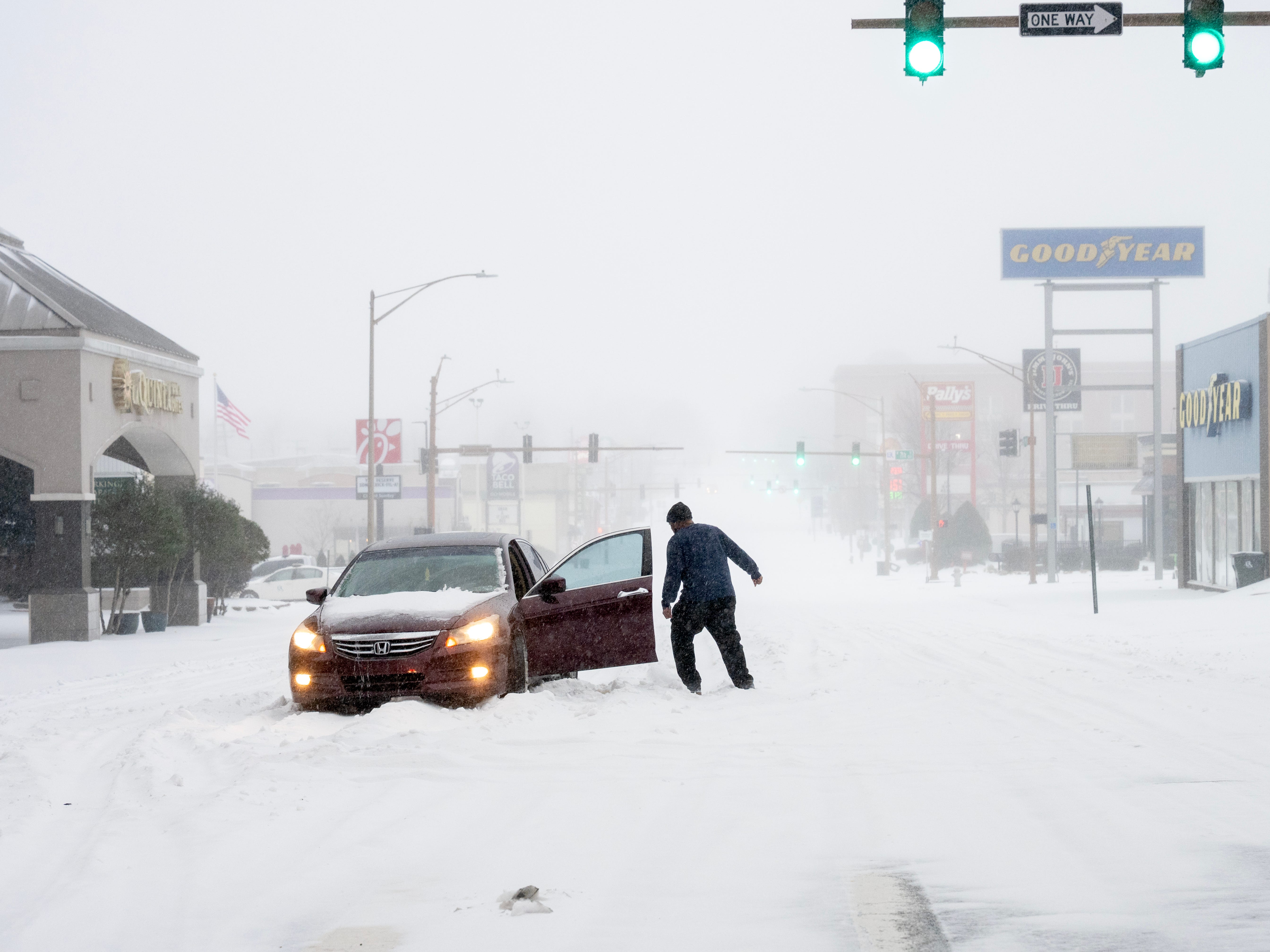 A person's car stuck in the snow on January 24, 2026 in Little Rock, Arkansas.