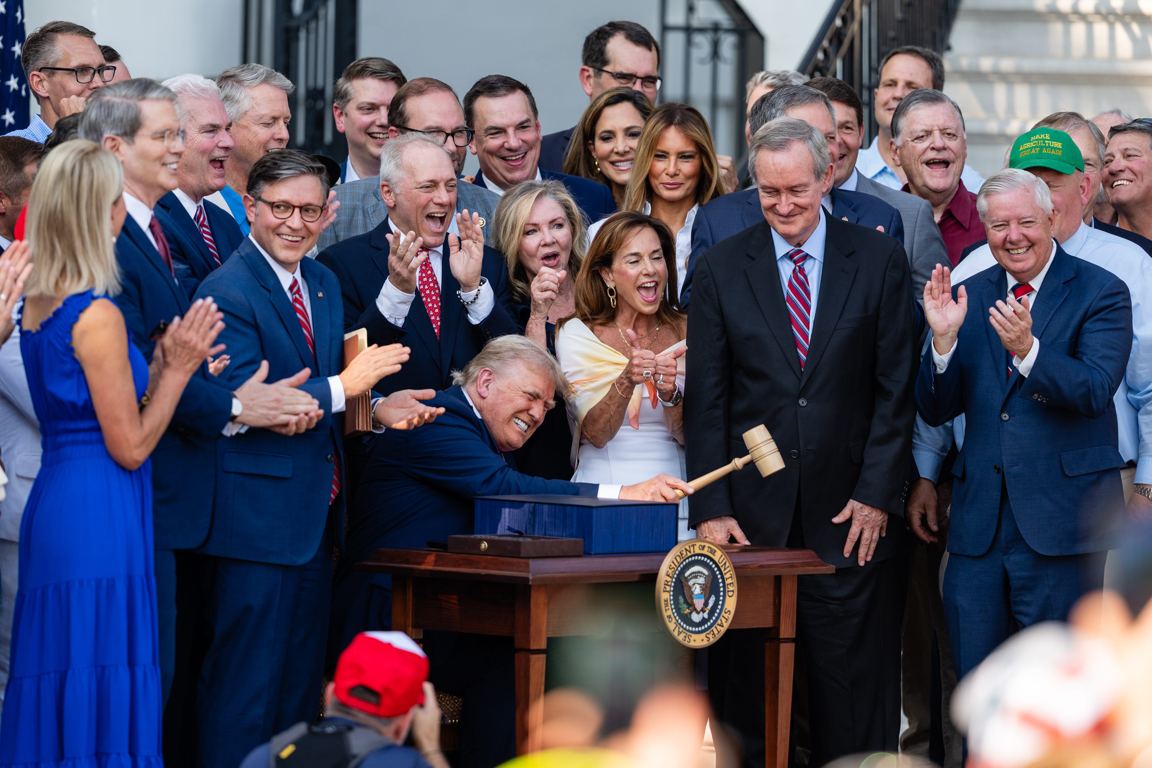 WASHINGTON, DC - JULY 04: U.S. President Donald Trump, joined by Republican lawmakers, holds a gavel after signing the "One, Big Beautiful Bill" Act into law during an Independence Day military family picnic on the South Lawn of the White House on July 04, 2025<br /><a href=