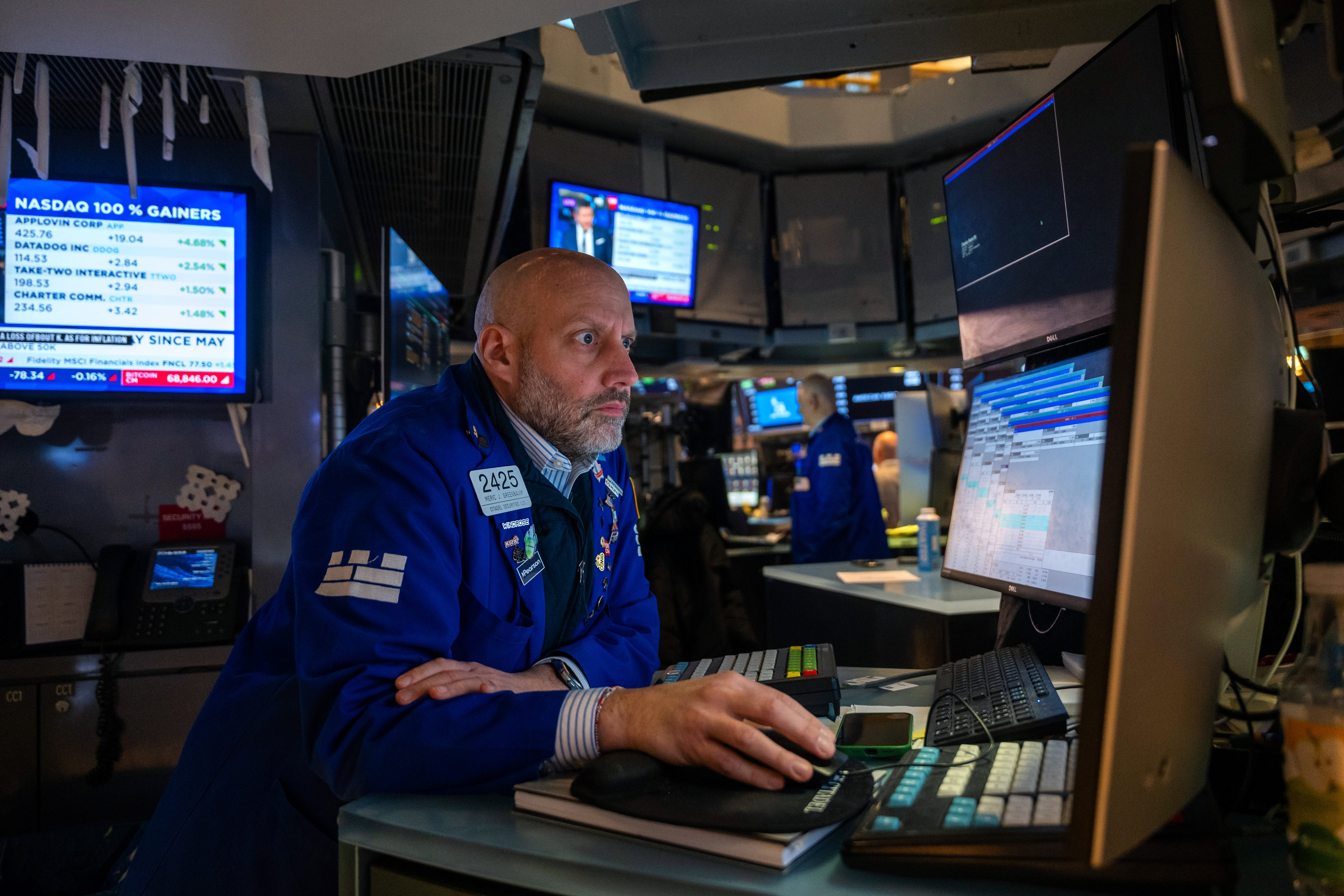 Traders work on the floor of the New York Stock Exchange