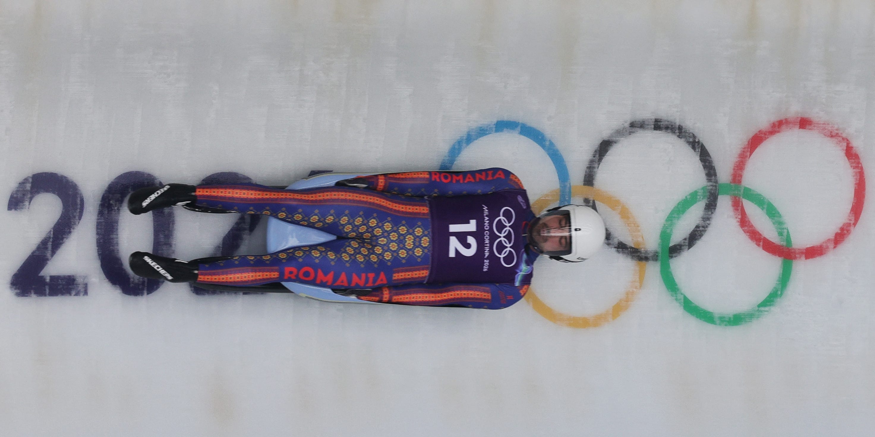 Eduard-Mihai Craciun of Romania in action on a luge sled during official training at the 2026 Winter Olympics.