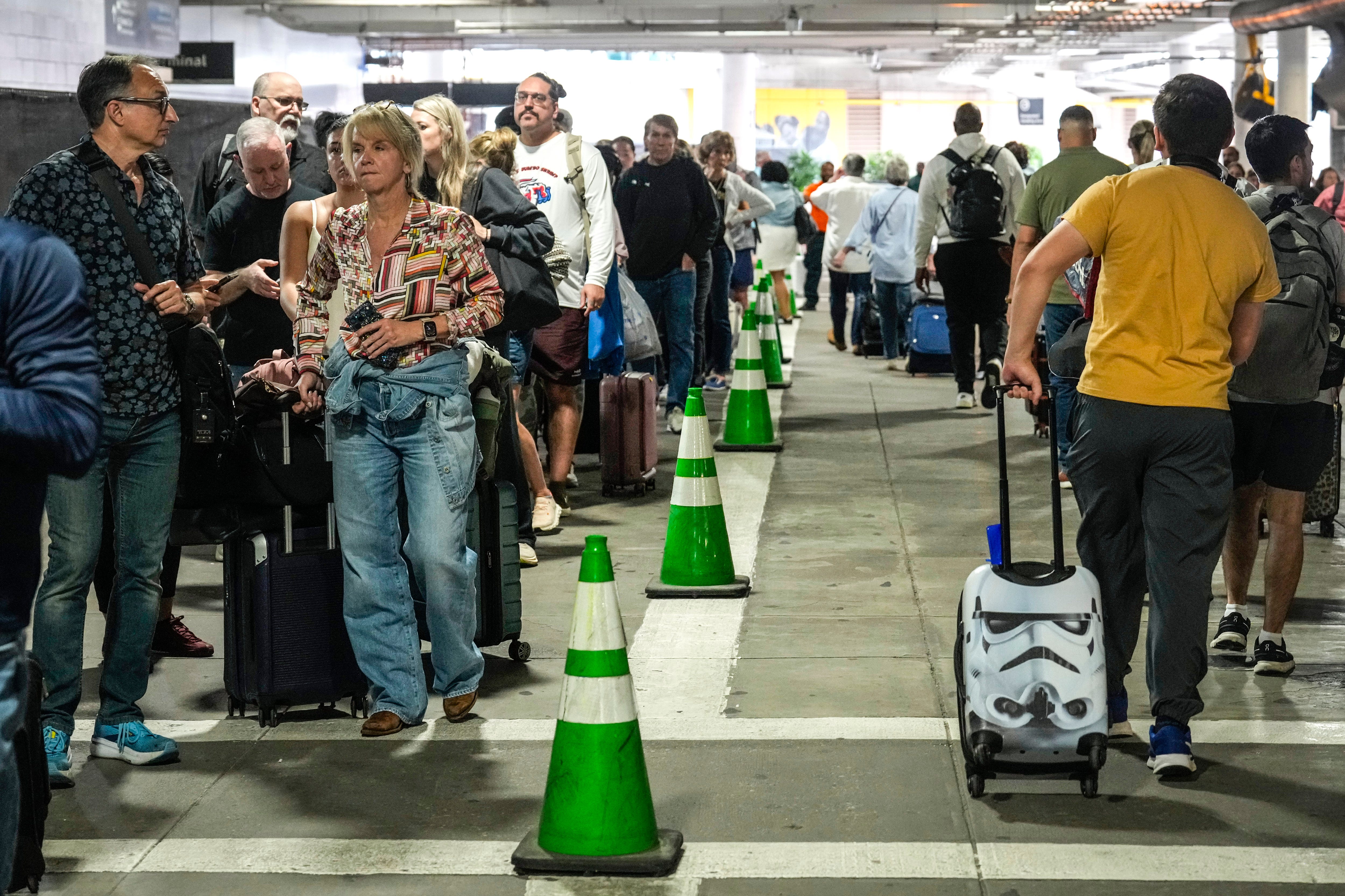 Passengers line up outside airports.